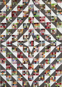 Smukt "Jubilæums tæppe" quiltet med stort åbent bladmønster
