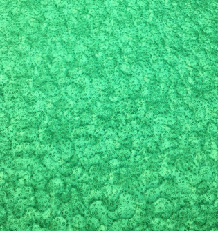 Bagsiden af smukt håndsyet tæppe