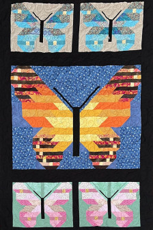 Smukt sommerfugletæppe quiltet med sommerfugle